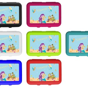 May include: Six lunch boxes with different colored lids and a mermaid design. The lunch boxes have a blue background with a mermaid, a ship, and gold coins. The name "Vanessa" is written in gold letters on each lunch box.