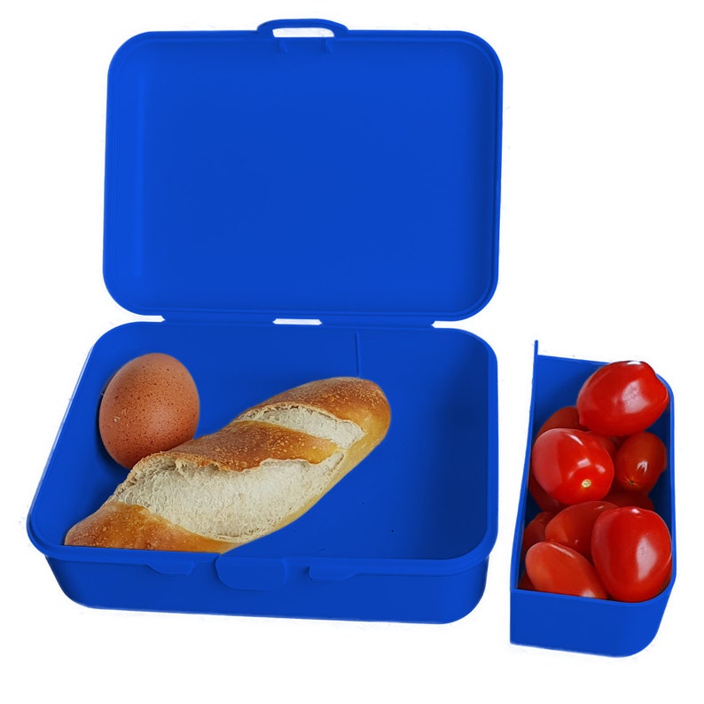 May include: A blue plastic lunchbox with a separate container for snacks. The lunchbox contains a loaf of bread and an egg. The snack container has red tomatoes.