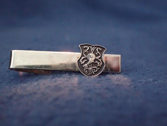 Tie Bar - Black Shield Featuring a Helmet and Shie
