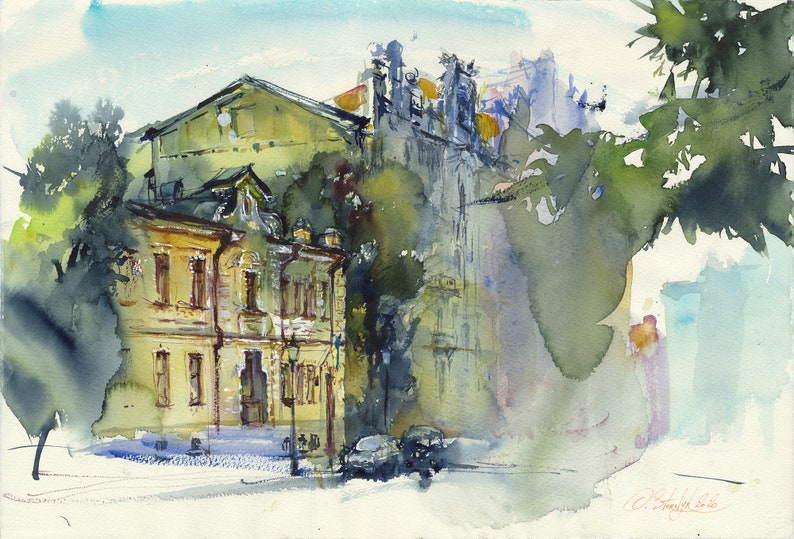 May include: Watercolor painting of a street scene with buildings in the background. The buildings are painted in shades of yellow, green, and blue. There are trees in the foreground, and the sky is a light blue.
