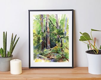 May include: Watercolor painting of a forest scene with tall trees and green foliage. The painting is framed in a black frame and is hanging on a white wall.