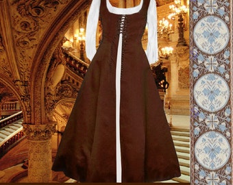 May include: A brown medieval-style dress with a white lace-up bodice and long white sleeves. The dress has a long skirt and a fitted bodice. The dress is photographed in a grand setting with ornate stairs and chandeliers.
