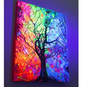 May include: Abstract painting of a black tree with branches against a colorful background of neon pink, orange, green, and blue.