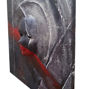 May include: Abstract painting on canvas with a textured surface. The painting features a black and white mask with a red mouth, set against a background of gray and red.