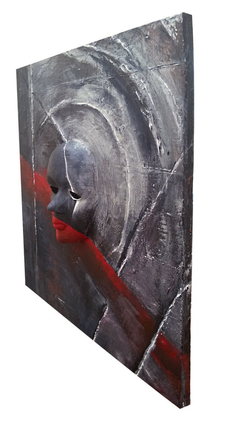 May include: Abstract painting on canvas with a textured surface. The painting features a black and white mask with a red mouth, set against a background of gray and red.