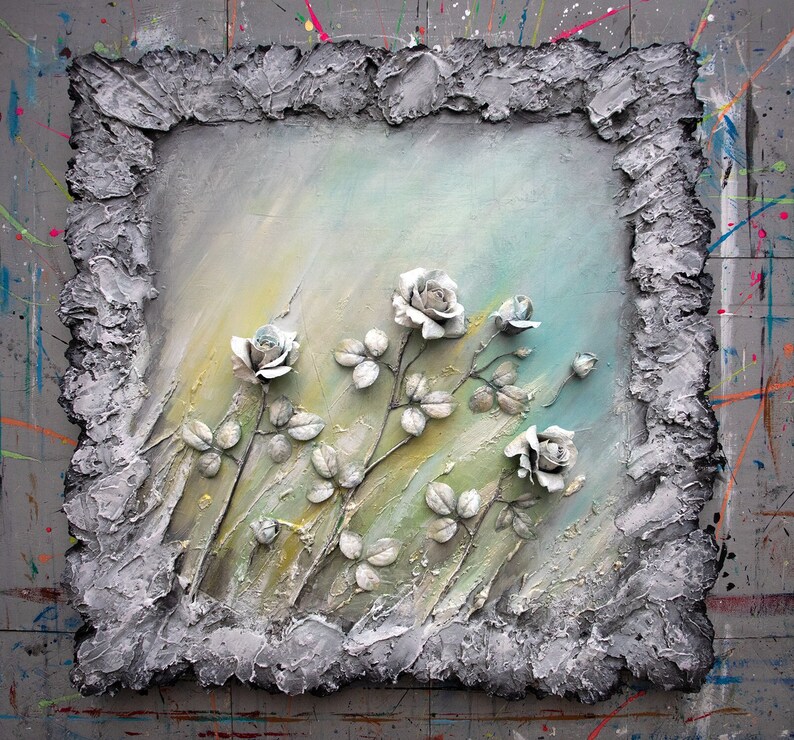 May include: A textured, gray frame surrounds a painting of white roses with green leaves on a light blue and green background.