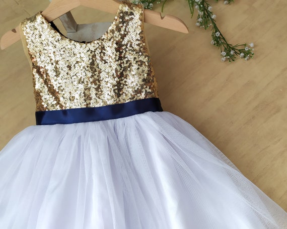 white dress with navy blue flowers