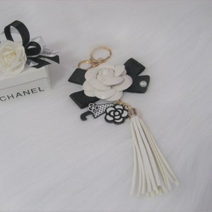 White leather flower black bow with charms, tassel, keychain, keyring Accessories