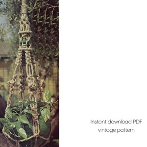 May include: A macrame plant hanger made of natural-colored rope, holding a green potted plant with leafy foliage. The hanger is suspended from a tree branch. Text on the right reads "Instant download PDF vintage pattern."