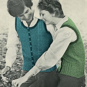 May include: A couple in knitted vests. The man wears a teal vest with buttons, the woman a green one. Both vests have a ribbed texture and are worn over white shirts. The couple is smiling. The image has a vintage aesthetic.