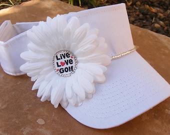 Womens Golf Sun Visors and GOlf Hats all done with swarovski crystals and your choice of center emblem scroll through pictures to see