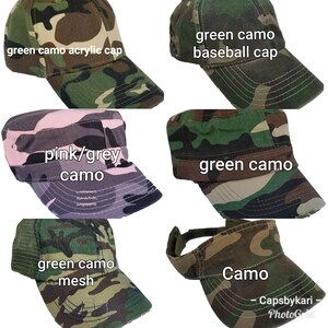 May include: Six different camouflage patterned baseball caps. The caps are in various styles, including a mesh cap, a baseball cap, a military style cap, and a visor. The caps are all in shades of green, pink, and grey.