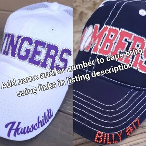May include: Two baseball caps with rhinestones. The white cap has the word "INGERS" in purple rhinestones. The blue cap has the word "OMBERS" in red rhinestones. The text "Add name and/or number to caps, brim using links in listing description" is on the image. The white cap has the word "Hauschildt" in purple rhinestones on the brim. The blue cap has the text "BILLY #17" in red rhinestones on the brim.