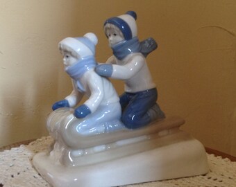 Vintage Wonderful Children sledding figurine by  Paul Sebastion- Holiday Decor or Gift