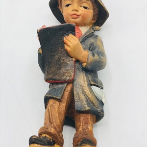 Vintage hand carved and hand painted Carving Little Boy Holding Book, Jobin Brienz Switzerland.  figurine-