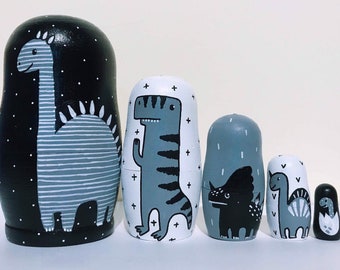 Monochrome dinosaur nesting dolls, black and white dino russian dolls