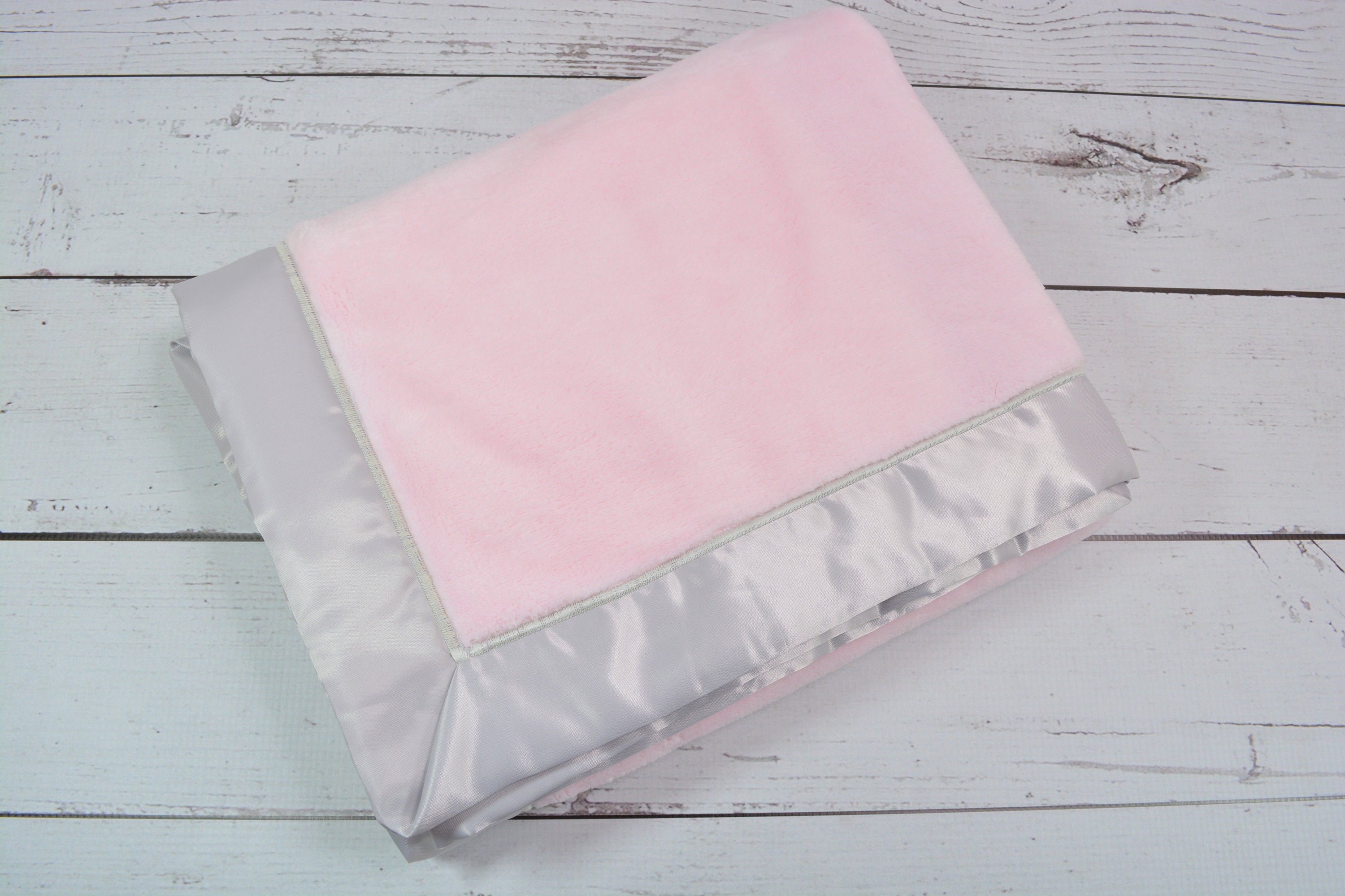 Pink baby blanket with satin trim sales