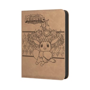 May include: A tan-colored trading card binder featuring a dark brown line art illustration of Eevee surrounded by crystal shapes. The text Scarlet & Violet Prismatic Evolutions is printed at the top. The binder has a black zipper closure.