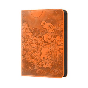 May include: A rectangular orange binder featuring an embossed illustration of multiple Cubone characters in a grassy landscape with a large sun in the background. The binder has a black spine and a zippered closure along the side edge.