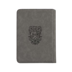 May include: A rectangular gray notebook with a smooth, matte finish. Centered on the front cover is a black graphic illustration featuring a stylized cat-like creature enclosed within a circular frame, surrounded by geometric line patterns.