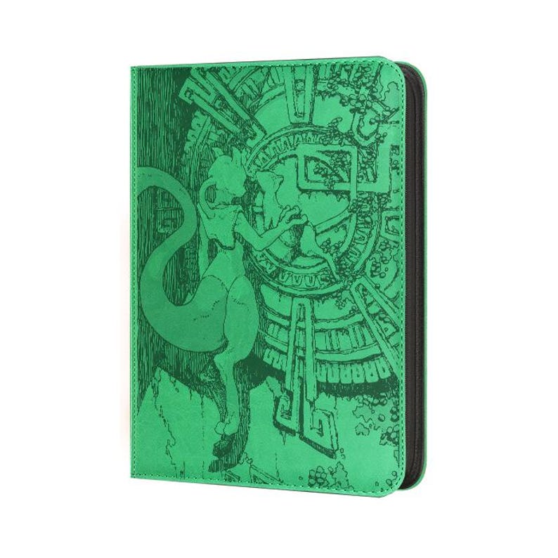 May include: A bright green rectangular card binder featuring a dark green etched illustration of a bipedal creature with a long tail standing before a large circular stone-like structure with intricate geometric patterns and ancient carvings.