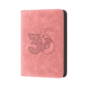 May include: A pink rectangular card binder featuring a repeating pattern of the character Mew. The front cover displays a large number 30 with a Mew character integrated into the design. The binder has a black zipper closure along the right side.