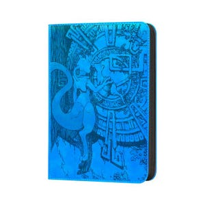 May include: A rectangular blue binder featuring a holographic finish and a detailed black line art illustration of a creature with a long tail standing before a large circular emblem with intricate geometric patterns and symbols.