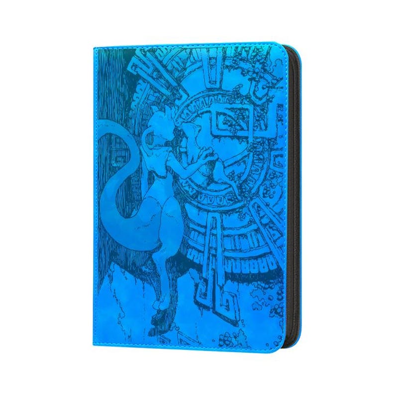 May include: A rectangular blue binder featuring a holographic finish and a detailed black line art illustration of a creature with a long tail standing before a large circular emblem with intricate geometric patterns and symbols.