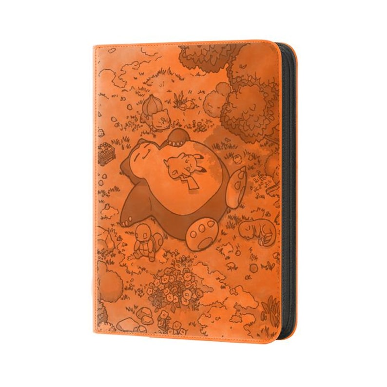 May include: Orange card binder featuring a detailed illustration of a sleeping Snorlax with Pikachu on its belly, surrounded by other Pok&eacute;mon characters. The binder has a black zipper and a textured surface, perfect for storing trading cards.