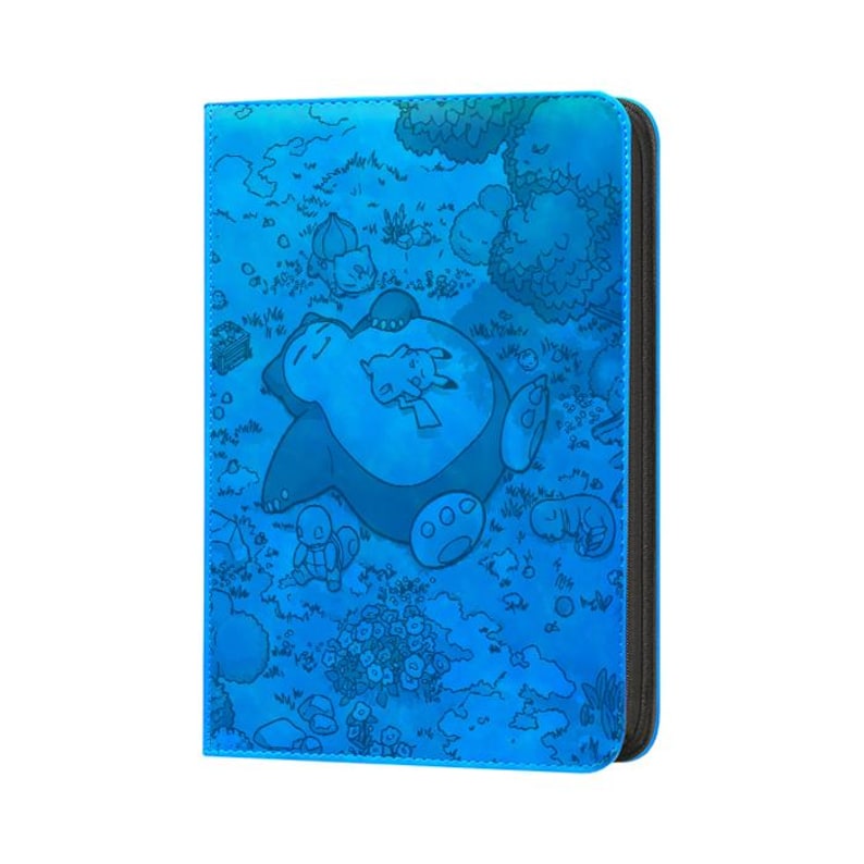 May include: A blue card binder featuring a cartoon illustration of Snorlax, Pikachu, and other Pok&eacute;mon characters. The binder has a zipper closure and a black spine. The design is a detailed, stylized illustration.