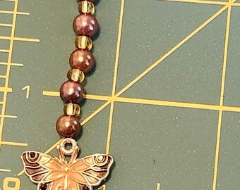 Black & Gold Butterfly with brown and gold colored beads