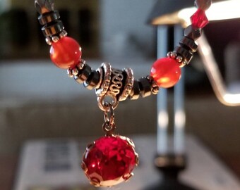 Aries for Love! Astrological necklace with carnelian, obsidian, red Swarovski crystal, bone, garnet and hematite. 24k gold or silver.