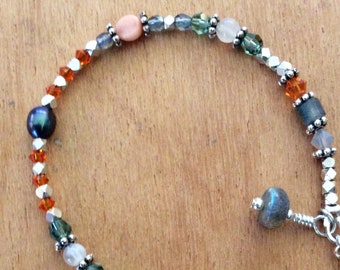 Pisces Astrological Bracelet! Brings intuition and spirituality. Labradorite, fresh water pearl, moonstone and orange Swarovski crystal!