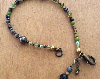 Virgo Astro Bracelet for handling details and organizing your life! Includes peridot, Swarovski crystal, black lace agate and pyrite!
