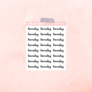 May include: A sheet of stickers with the word "laundry" written in cursive, repeated multiple times. The stickers are white with black lettering and are arranged in three columns.