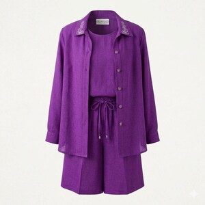 May include: A vibrant purple three-piece set consisting of a long-sleeve button-down shirt with white floral embroidery on the collar, a matching sleeveless top, and high-waisted shorts featuring an adjustable drawstring waist and side pockets.