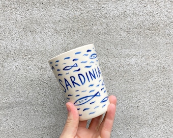 Ceramic cup with sardines, all over fish pattern