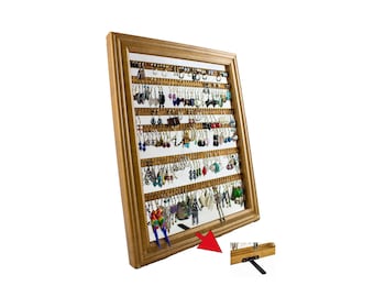May include: A wooden framed earring display with a light brown finish. The display is filled with various earrings of different colors and styles. The display has multiple rows of small holes to hang earrings. A small stand is attached to the back.