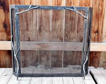 Free standing fireplace screen with twig handles.