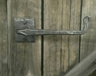 Wrought iron toilet paper holder.
