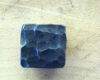 Hammered iron drawer pull knob.