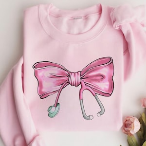 Coquette Nurse Stethoscope Bow Sweatshirt, Gift for Nurse, Bow Oversized Shirt, Nurse Appreciation, Christmas Gift for Nurse, Pink Bow