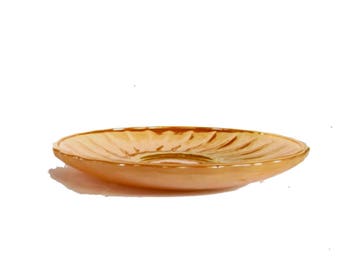 Anchor hocking mid century peach luster saucer for Suburbia series tea set. Four are available.