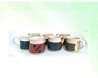 Handmade pottery wheel thrown farmhouse coffee latte cappuccino seven cups set, hand painted blue and brown on white.