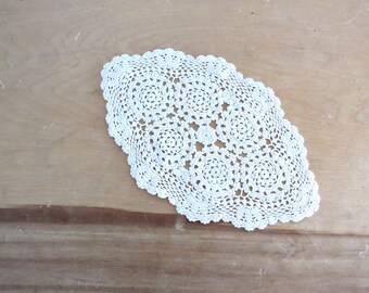 Vintage small hand crocheted white tabletop cotton string pointed oval doily