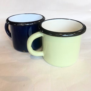 Two small handled enamel yellow and blue cups, vintage kitchen rustic enamelware cups