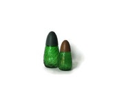 Two vintage "Pino Silvestre " glass empty bottles. Eau de cologne made by Vidal family. Made in Italy. Green glass with blue and brown caps.