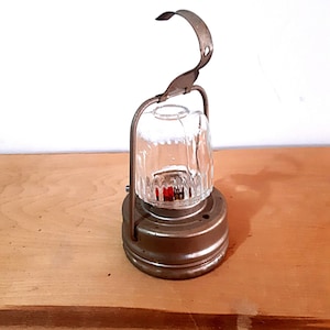 Lantern flashlight torch, hanging railroad flashlight. Nickel plated metal and thick clear glass. 1979 or earlier.