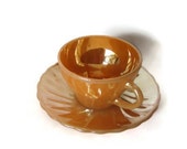 Anchor hocking tea set. Suburbia peach luaterware. One cup and saucer. Swirl pattern. Oven proof. Made in USA. Mid century.