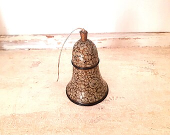 Golden blue floral delicate tall wood bell, black on the inside. With a bell clapper.